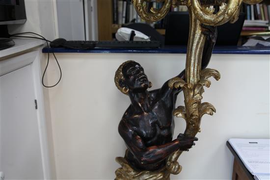 A pair of Venetian carved, painted and parcel gilt blackamoor torcheres, H.6ft 6in.